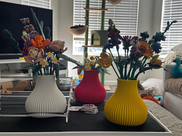 Customer photo: white, pink and yellow ribbed LEGO flower vases
