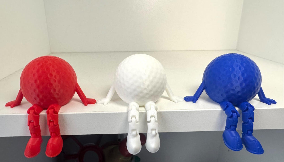 3D Printed Golf Ball Desk Toy: Flexible Leg Shelf Decor